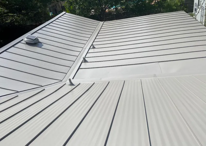 Solar attic fan installed on a metal roof for Roof Ventilation in Bonney Lake
